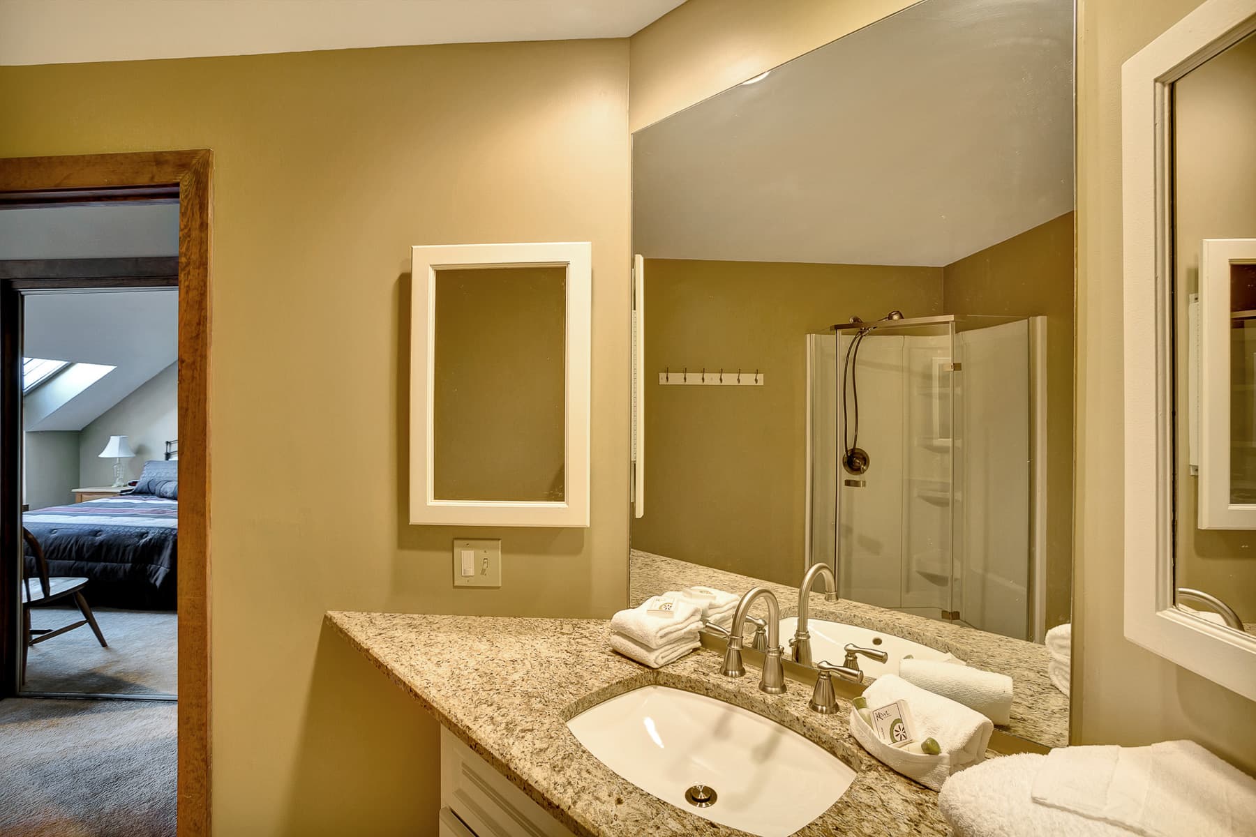 Bathroom with stand up shower attached to the master bedroom