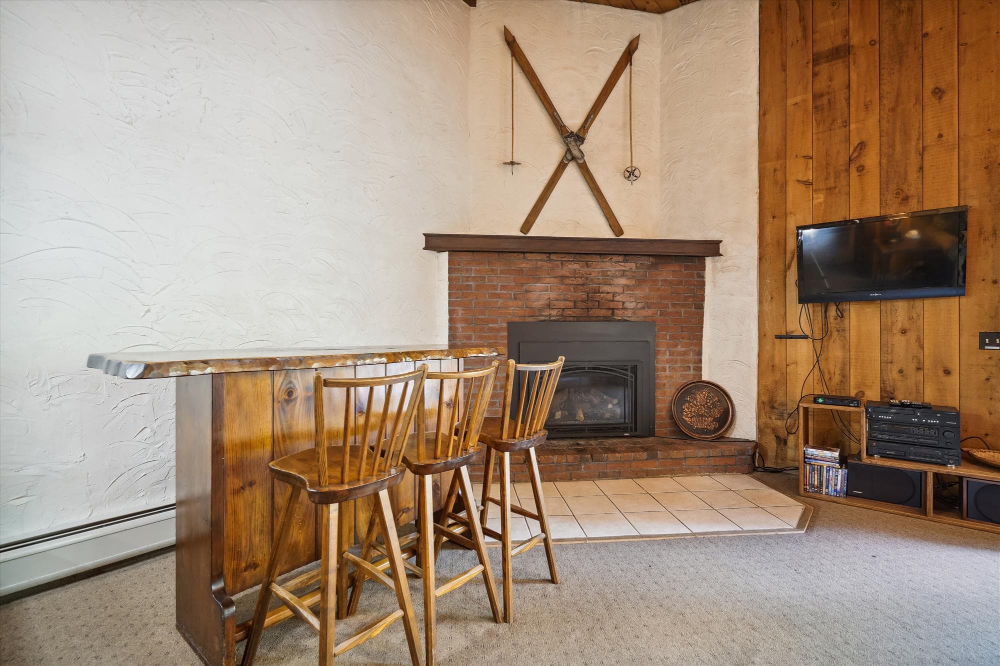 Propane fireplace and seating at small bar for your entertainment