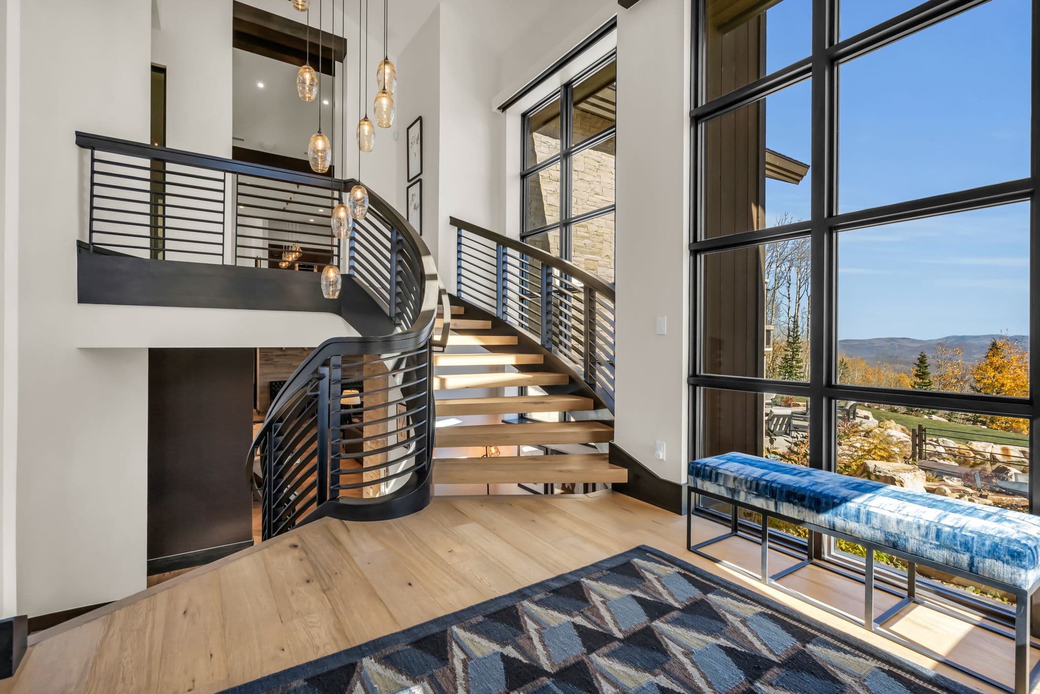 Stairs, a Bench, and Hanging Lamps in the Sanctuary Chalet at The Colony