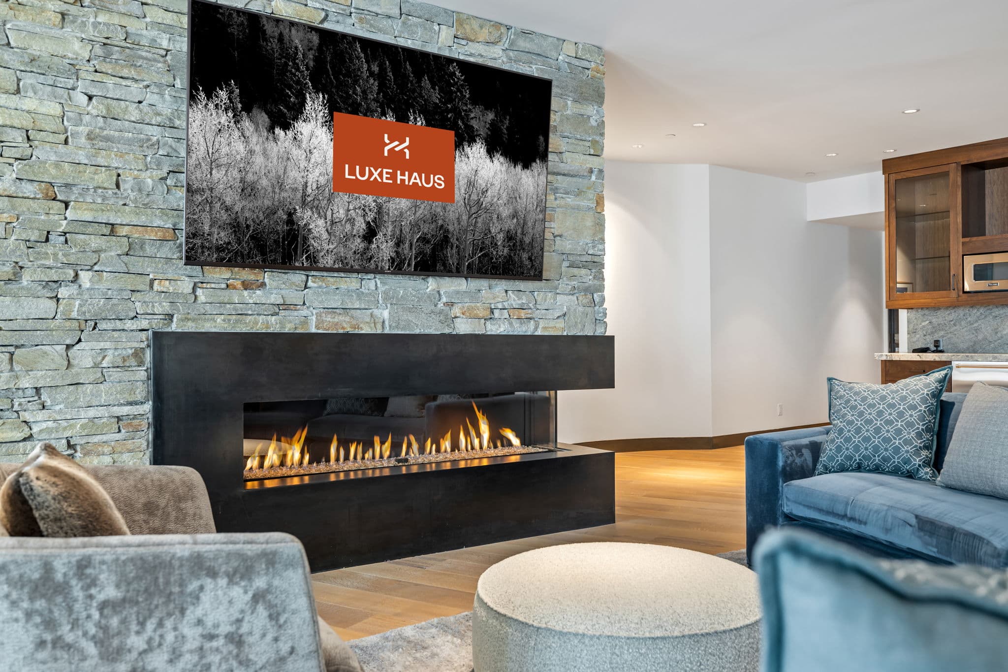 A close up view of a fireplace with a seating area.
